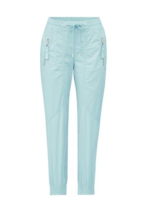 Light blue joggers made from soft fabric, featuring an elastic waistband, drawstring, and two zippered pockets on the sides.