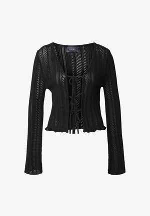 Black knit sweater with long sleeves, lace-up front, and ruffled hem. Features a textured, open weave pattern and V-neckline.