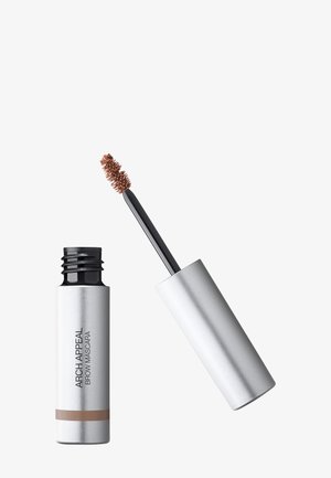 Tube argenté de mascara pour sourcils Arch Appeal marron avec applicateur en baguette retiré, montrant la brosse à poils imprégnée de produit.