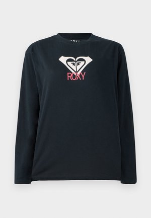 Black long-sleeve T-shirt made of cotton, featuring a white heart logo with two faces and "ROXY" in pink below the logo.