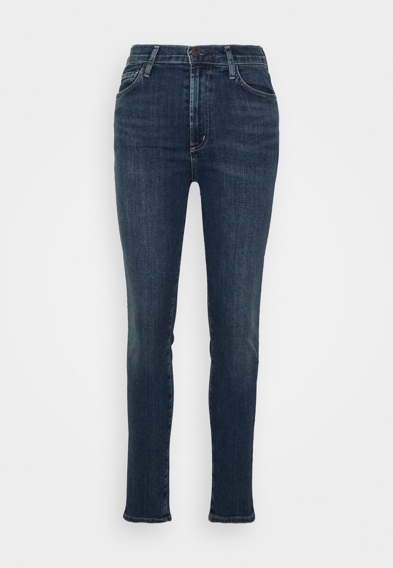 Jean skinny bleu foncé avec taille haute, design à cinq poches et détails de décoloration subtils à l'avant. Tissu en denim avec un léger stretch.