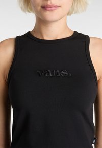 Black sleeveless top made of cotton, featuring a subtle embroidered "vans." logo in the center and a round neckline with a smooth texture.