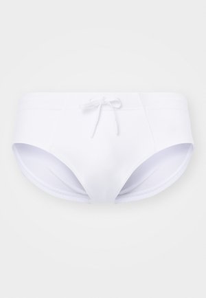 White swim briefs with a smooth texture, featuring a front tie and side openings. Made of stretchy swimwear fabric.