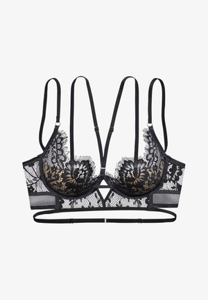 Black lace bralette with gold accents, featuring a floral pattern, adjustable straps, and a geometric cutout in the center front.