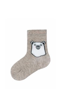 Calza di cotone beige con design di una faccia di orso polare sul davanti. Texture liscia con bordo a costine alla caviglia.