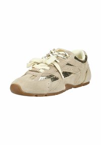 Beige suede sneaker with white laces, bronze metallic textured panels, and brown rubber sole, angled left on white background.