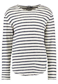 Koszula z długim rękawem, wykonana z lekkiego materiału, w granatowo-białe poziome paski. Posiada zaokrąglony dekolt i lekko strzępiony dół.