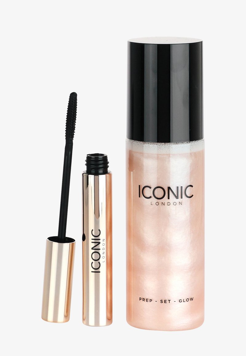 Two beauty products: a rose gold spray bottle labeled "Prep - Set - Glow" and a black mascara tube with a textured wand.