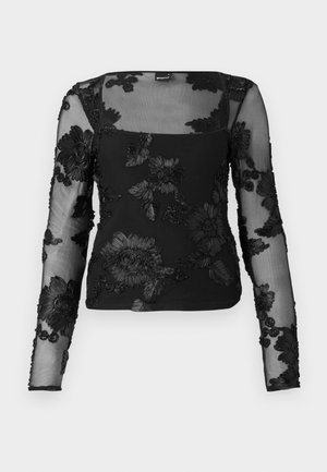 Blusa nera a maniche lunghe realizzata in tessuto trasparente, caratterizzata da motivi floreali ricamati in rilievo sulle maniche e sul davanti, con scollatura quadrata.