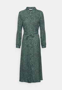 Robe midi à manches longues, boutonnée, avec col et ceinture nouée, présentant un motif abstrait de feuilles en turquoise et noir.