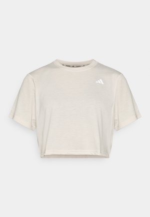 T-shirt corta a maniche corte cropped in misto cotone color avorio, con piccolo logo nero sul petto. Tessuto morbido e scollatura rotonda.