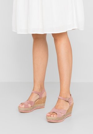 Wedge sandals in soft pink suede with an adjustable ankle strap and a textured cork platform. Lightweight design with open-toe style.