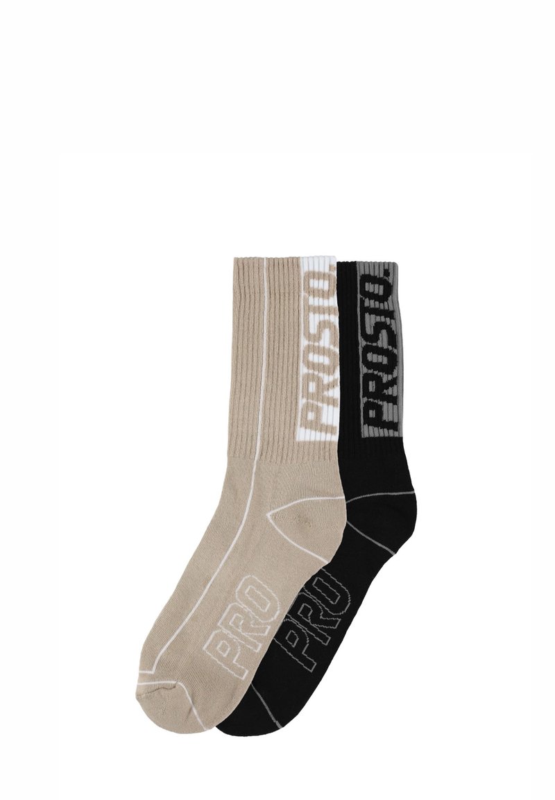 Dwie pary prążkowanych skarpet w kolorze beżowym i czarnym, z kontrastującym napisem "PROSTO" w białym i szarym kolorze na ściągaczach. Wykonane z bawełny.