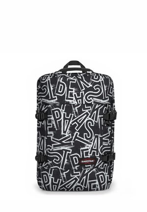 Black backpack featuring bold white letters in various styles. Includes adjustable straps and a top handle for carrying.