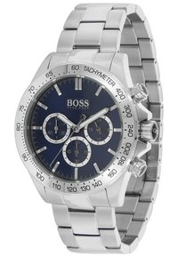 Silver stainless steel chronograph watch with a dark blue dial, three sub-dials, tachymeter bezel, and polished link bracelet.