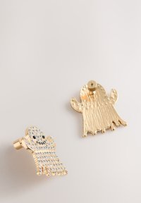 Gold-tone ghost-shaped earrings, one adorned with clear crystals, featuring textured surfaces and a stud fastening.