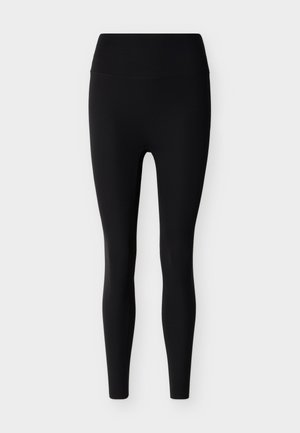 Μαύροι ψηλόμεσοι κολάν μέχρι τον αστράγαλο με λείο κορδόνι στη μέση και στενή εφαρμογή, σε φόντο ανοιχτό γκρι.