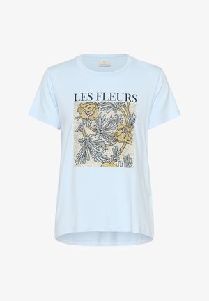 Light blue cotton t-shirt featuring a floral print in yellow and purple, with a textured background and the text "LES FLEURS" in bold black letters.