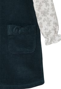 Navy Cord-Rippkleid mit einer Tasche und einer Schleifenakzent. Leichte, floral gemusterte Ärmel aus weichem, strukturiertem Material.