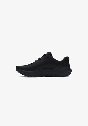 Schwarze Sportschuhe mit glatter Textur, runder Form und Obermaterial aus Netzgewebe. Mit gepolsterter Sohle und farblich passenden Schnürsenkeln.