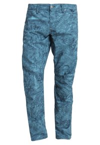 Blue patterned pants featuring a textured surface with irregular swirls, a zip fly, and front pockets. Material appears durable and smooth.