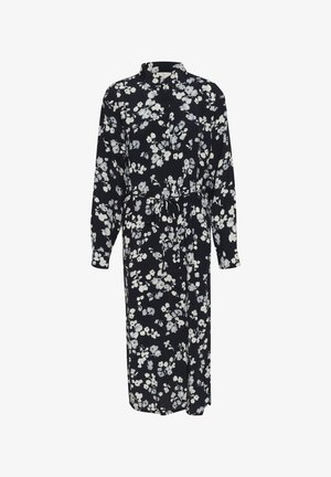 Lange, zwarte bloemenjurk met een kraag, knopen aan de voorkant, lange mouwen en een strikceintuur. Heeft witte en lichtgrijze bloemenpatronen. Zachte stof.
