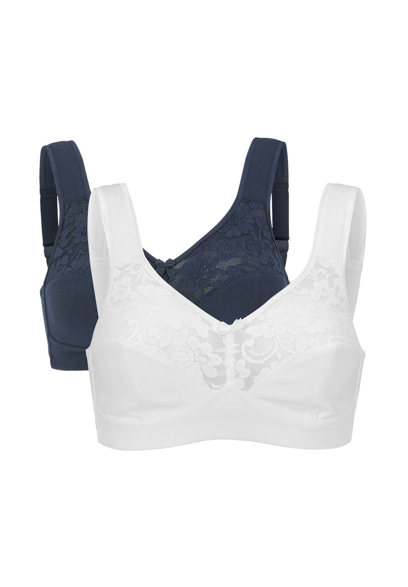 Två bh:ar: en marinblå med spetsdetaljer och justerbara axelremmar, den andra vit med spetsöverdrag och sömlös design.