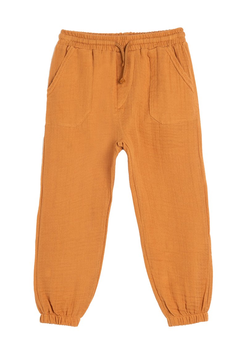 Orange, lette bukser med elastisk talje, snøre og to frontlommer. Elastiske manchetter ved anklerne for en tætsiddende pasform.