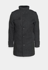 Manteau en mélange de laine noire avec col montant, fermeture par boutons et poches latérales. Tissu texturé avec une coupe ajustée et des épaulettes.