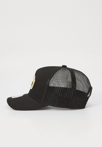 Black baseball cap with a curved visor. Front panel fabric, side and back mesh. Features an embroidered yellow logo on front.