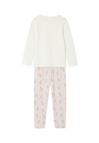 Long-sleeve white top paired with light pink pants featuring unicorn, rainbow, star, and moon patterns, shown from the back.