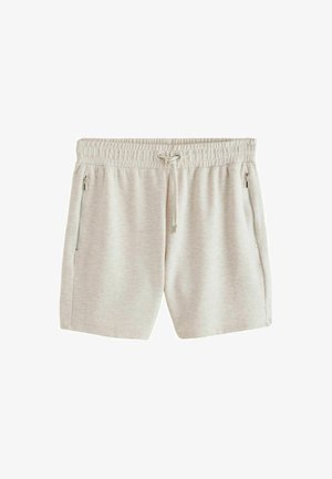 Béžové voľné šortky s elastickým pásom, nastaviteľnou šnúrkou a zipsovými bočnými vreckami na bielom pozadí.