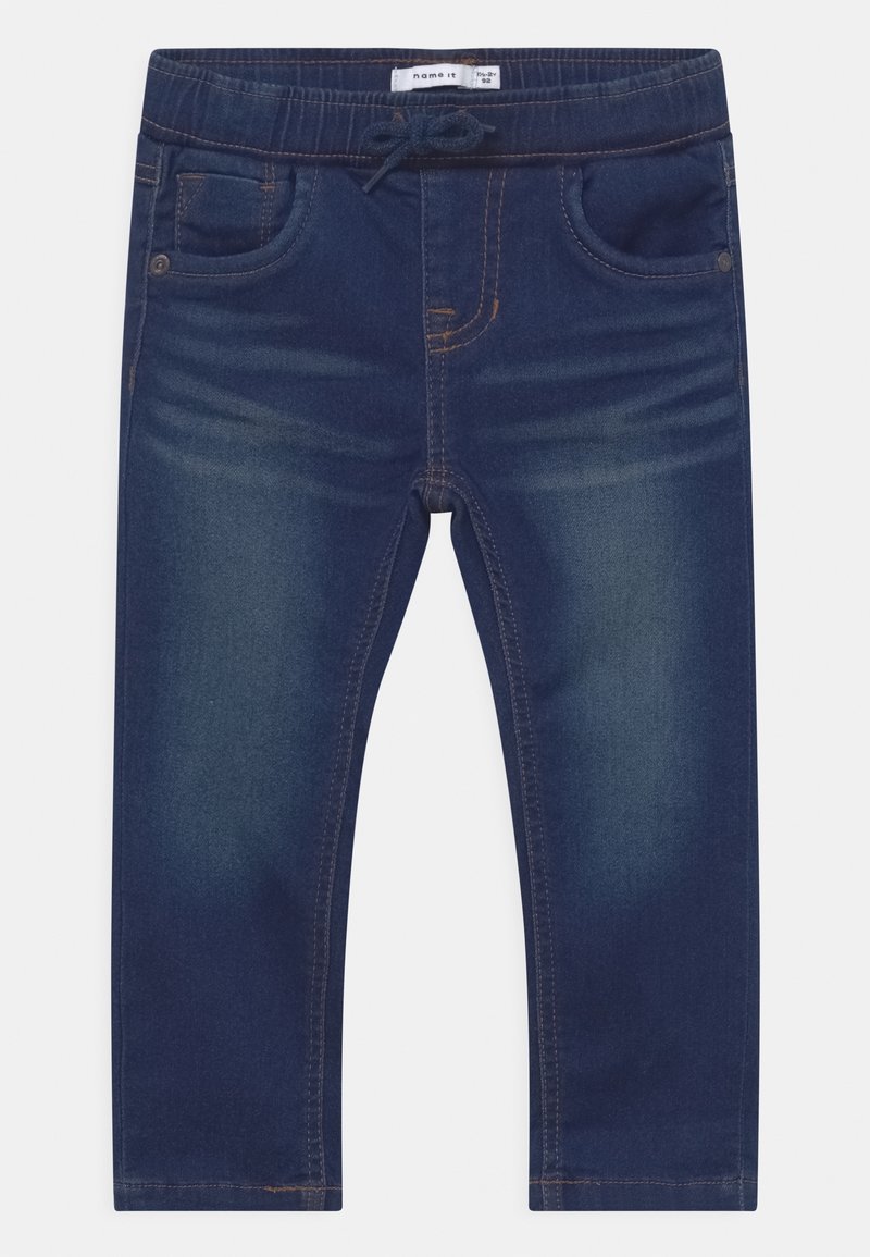 Jean enfant bleu marine avec ceinture élastique, poches avant et cordon de serrage, présentant un léger effet délavé sur les cuisses.