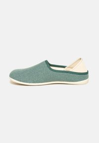 Green textile slip-on shoe with a soft, textured surface and a light cream rubber sole, featuring a low back design and contrasting trim.