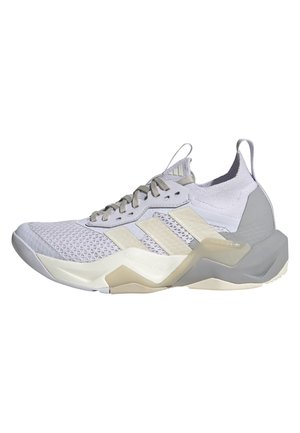Lichtgrijze en beige Adidas sportschoen met mesh bovenwerk, drie zijstrepen, veters aan de voorkant en een gedempte zool met torsiesysteem.