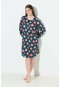 Camicia da notte a maniche lunghe in tessuto blu marino con stampa di decorazioni natalizie colorate, scollatura arrotondata e spacchi laterali per facilitare i movimenti.
