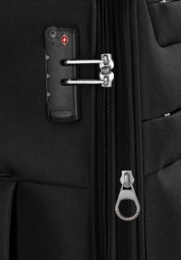 Black suitcase featuring a TSA lock mechanism, durable fabric, double zipper closure, and a large, silver pull tab labeled "Expandable."