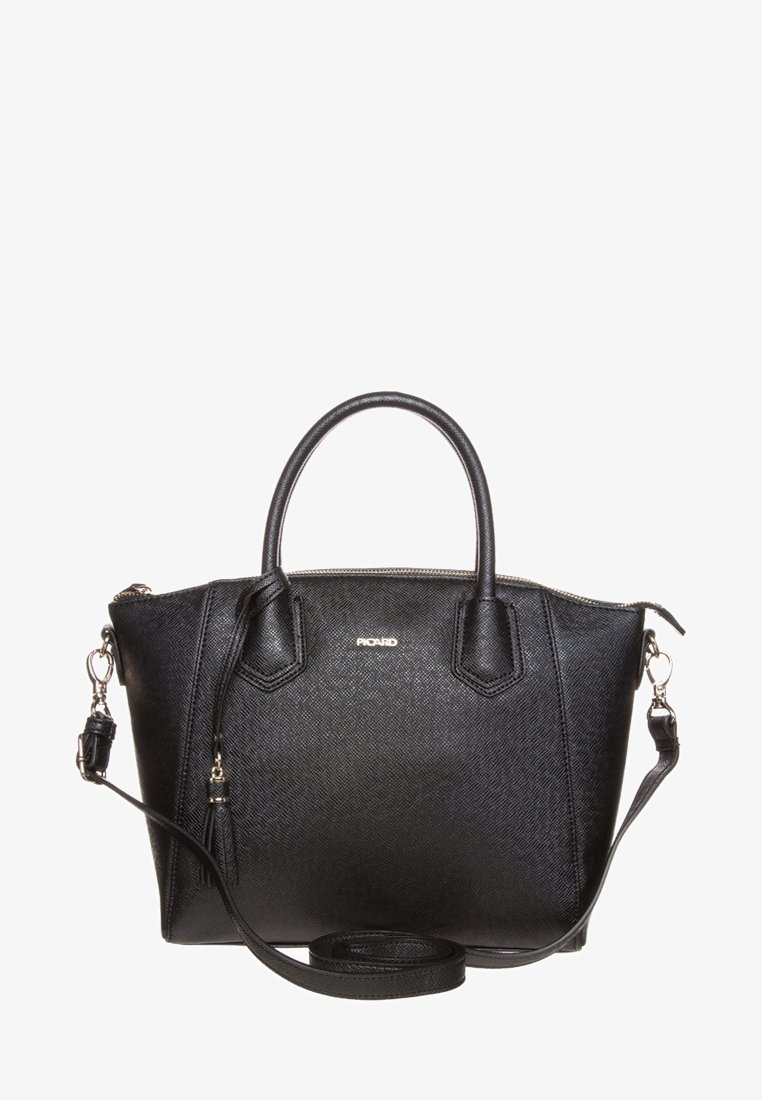 Sac à main en cuir noir texturé avec deux poignées courtes, bandoulière amovible, détail pompon et logo de marque doré sur le devant.