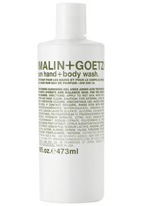 Weiße Flasche mit runder Form, mit grüner Schrift. Enthält 473 ml Rum Hand- und Körperwaschmittel. Einfaches Design, aus Kunststoffmaterial.