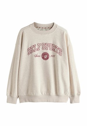 Light beige sweatshirt featuring a crew neck, dropped shoulders, and maroon "SELF SPORTS" text. Elastic cuffs and hem, soft fabric texture.