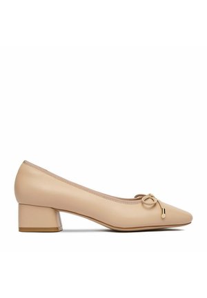 Beige leather low-heeled women's shoe with rounded toe, small bow decoration on front, and block heel on white background.