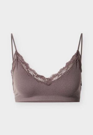 Bruine bralette met kanten rand langs de halslijn, verstelbare bandjes en een zacht, rekbaar materiaal. Simpel, niet-voorgevormd ontwerp.