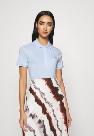 Lacoste Polo - ruisseau