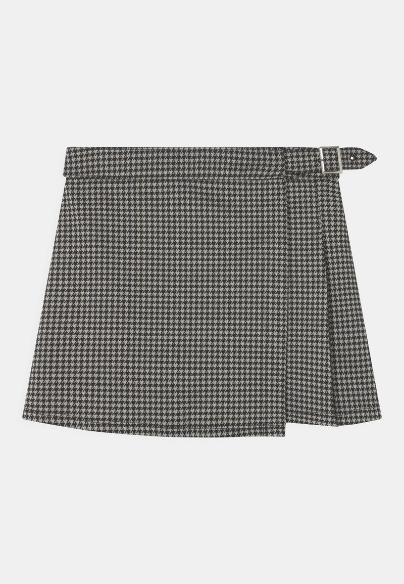 Sort-hvid skakmønstrede nederdel med et bælte, der har et plisseret design og en sidelukning. Fremstillet af struktureret stof.