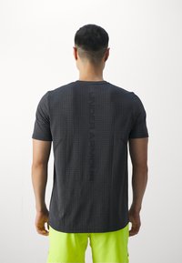 Under Armour VANISH SEAMLESS GRID - Sports T-shirt - castlerock/gray