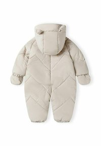 Salopetă de iarnă puffer bej deschis cu glugă, dotată cu urechi de urs, manșete elastice, cusături în formă de zigzag și fermoar frontal pentru o îmbrăcare ușoară.