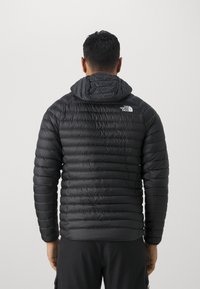 The North Face BETTAFORCA HOODIE - Jakna ispunjena paperjem - black