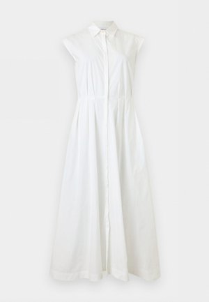 Vestido blanco sin mangas con botones, cuello y cintura entallada, que se extiende en una falda larga y fluida.