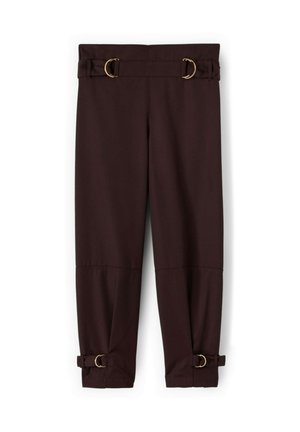 Mørkebrune smalle bukser med justerbare stropper med guldspænder ved talje og ankler, vist fladt på hvid baggrund.