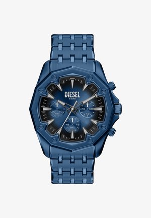 Blåt ur i rustfrit stål med en ottekantet kasse, sort og blå urskive, tre underskiver og lænke i metal. Har mærket "DIESEL."
